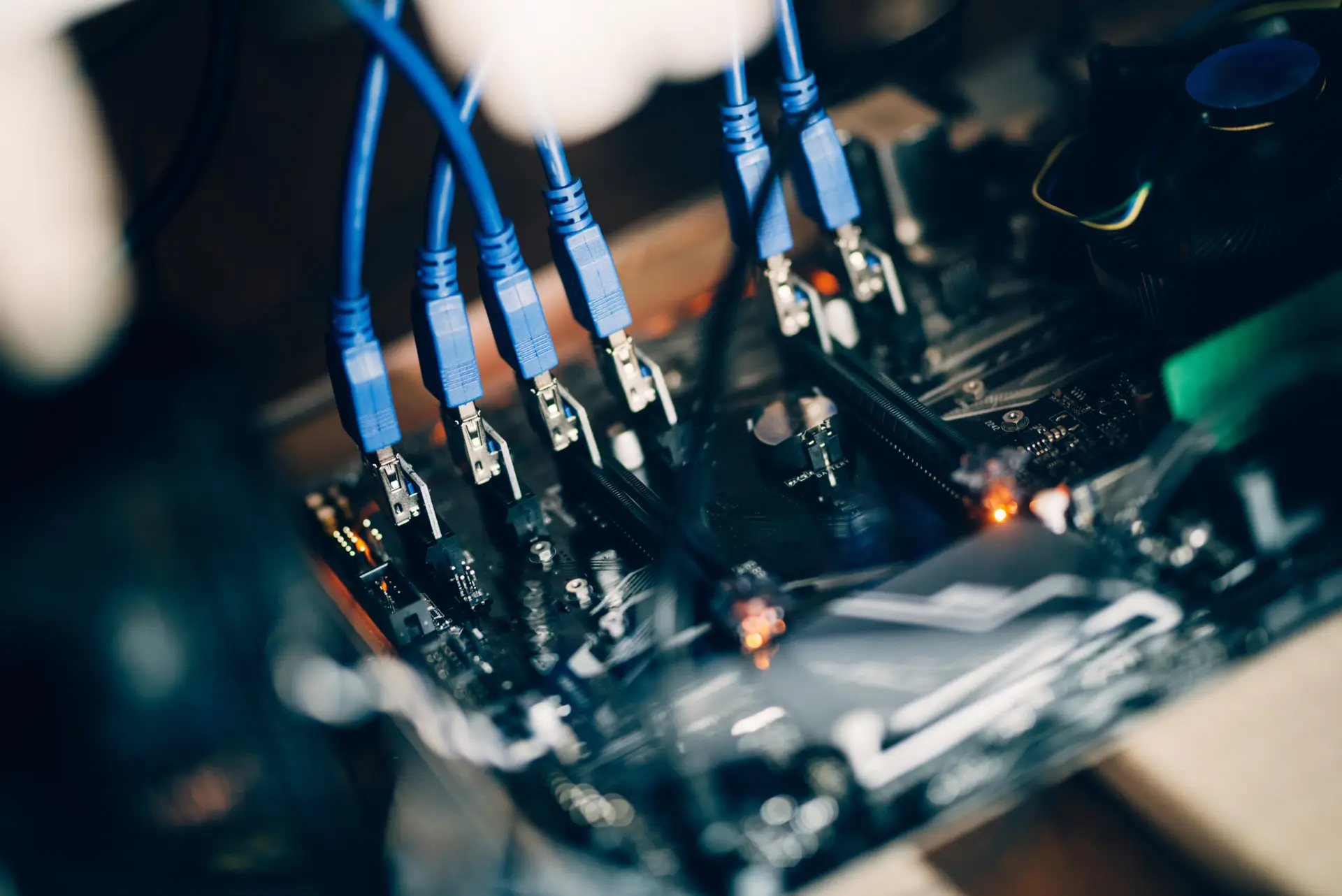 Close-up of cables connected to computer hardware components