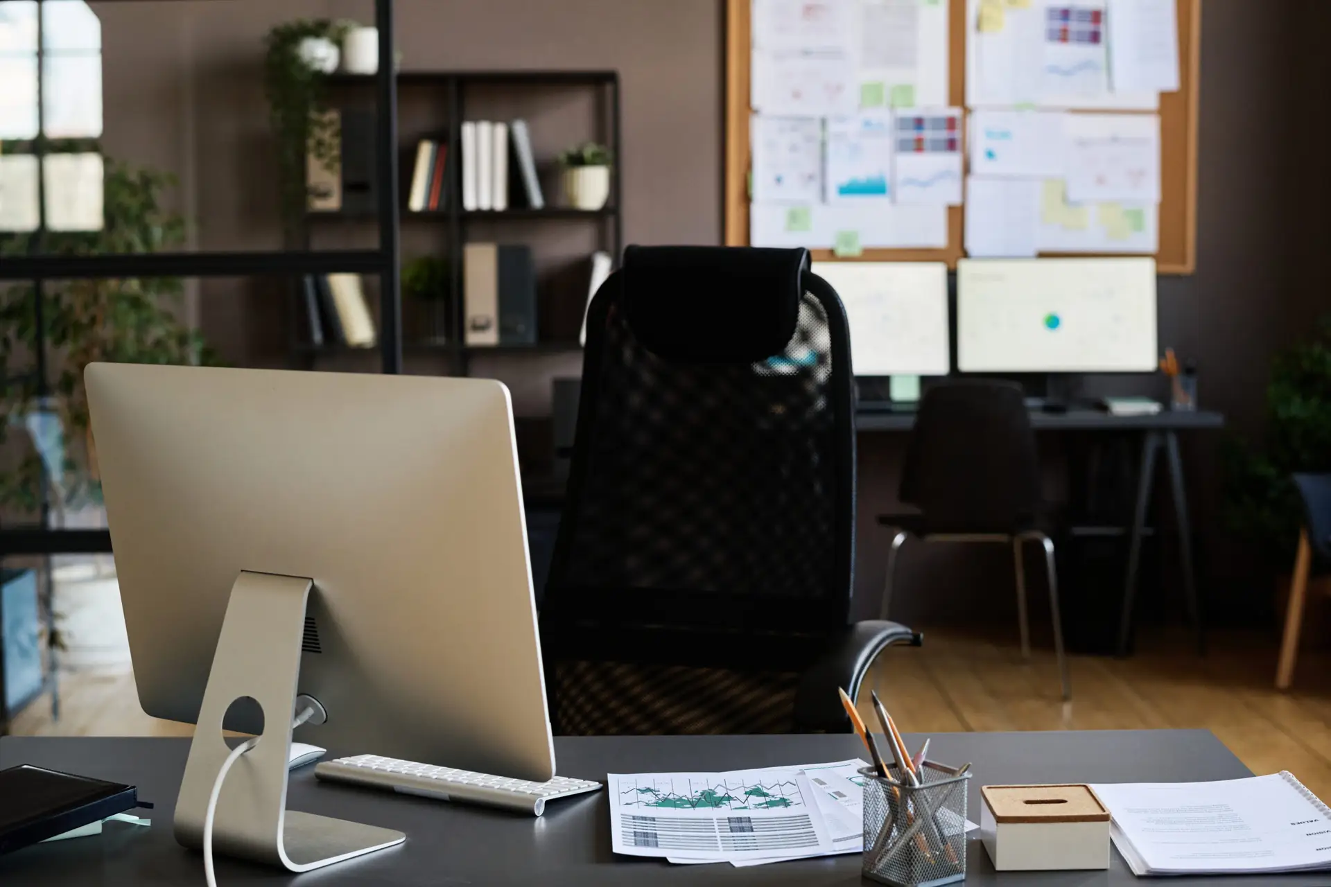 Computer monitor on a manager’s desk in a bright office